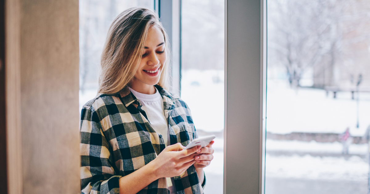 A young woman using a mobile phone. (Photo: Shutterstock)